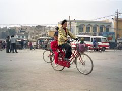 20 Kashgar Old City Street Scene 1993 Woman And Child On Bicycle.jpg